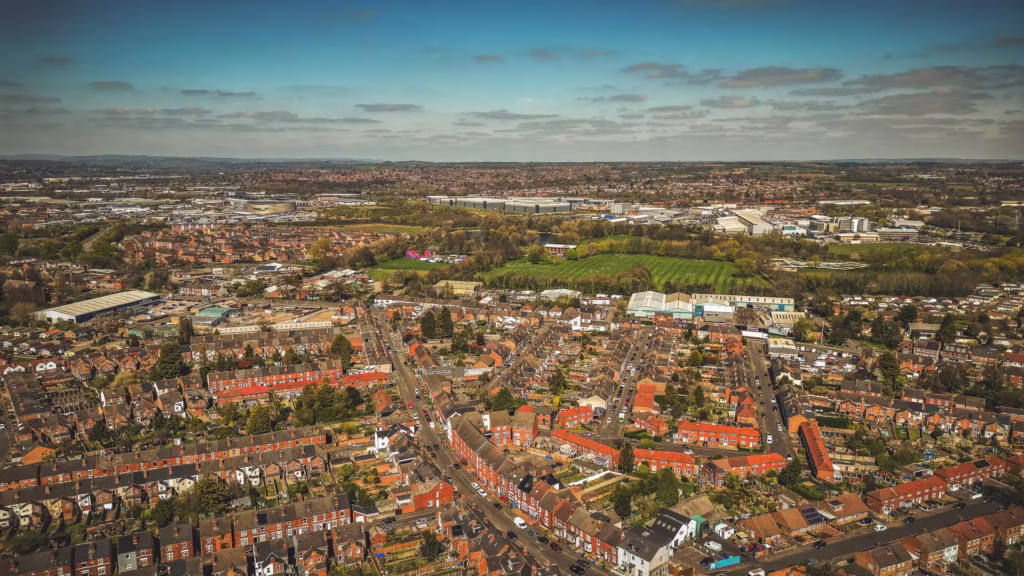 Aerial view of suburban houses and landscape.