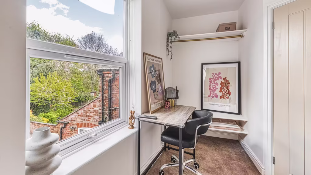 Bright home office with scenic garden view.