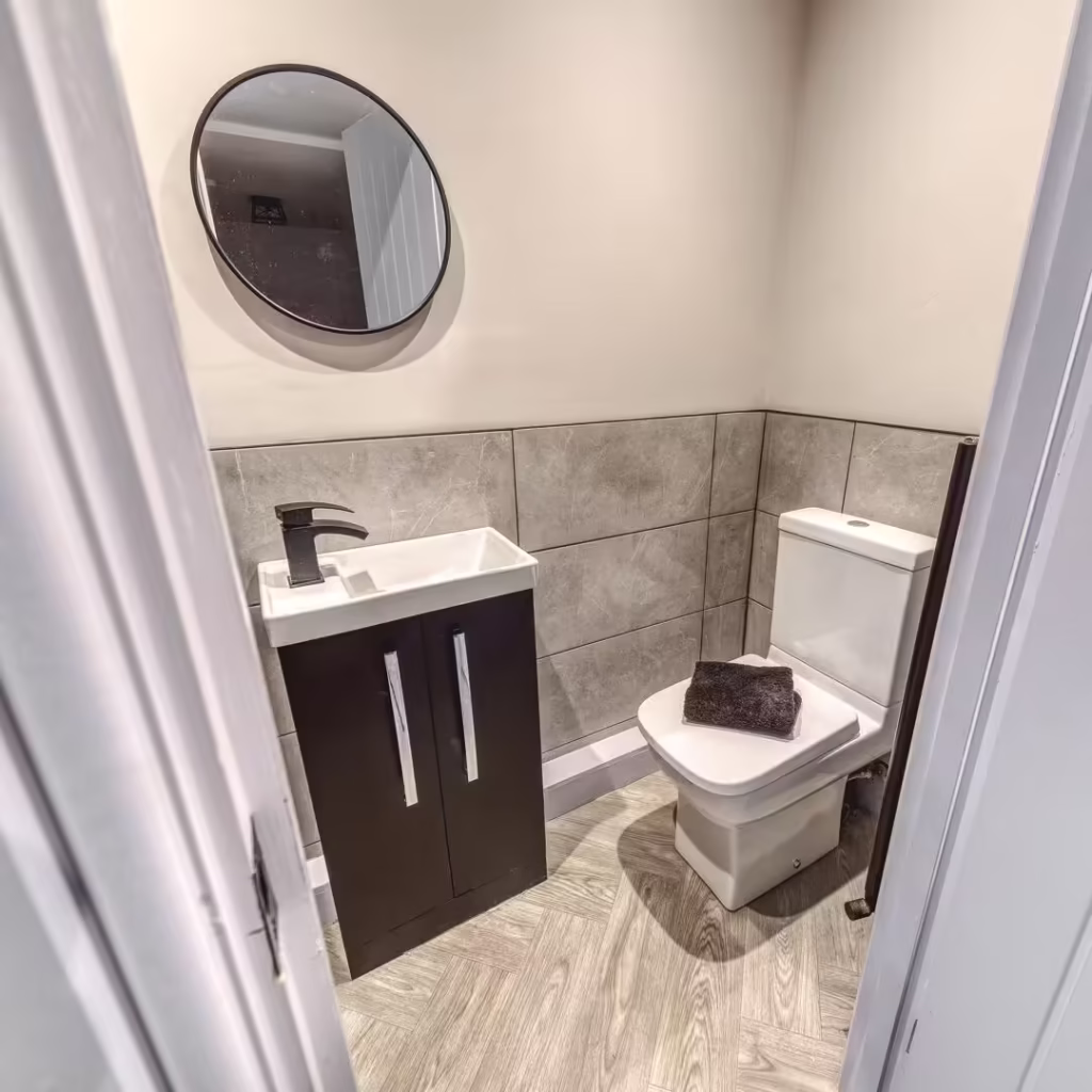 Small modern bathroom with sink and toilet